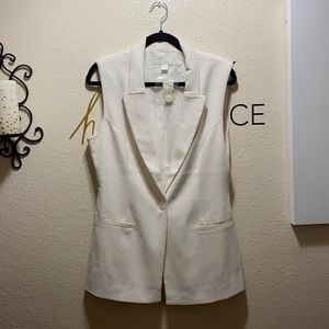 Beautiful cream vest new with tags.